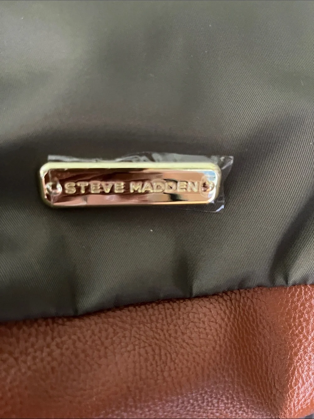Steve Madden dark green backpack purse with change purse.